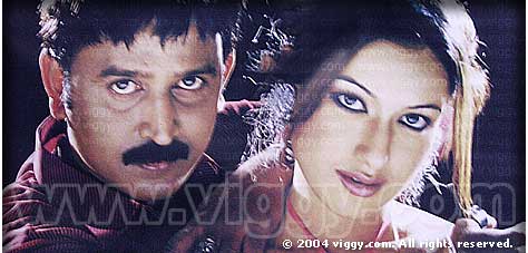 Ramesh Aravind and Madhuri Bhattacharya in Kannada film Bisi Bisi